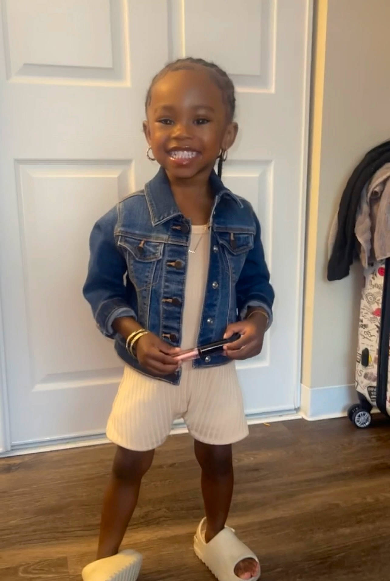 Alayah is registered to the contest to win money with this photo: baby_toddler_clothing, collar, denim, dress_shirt, electric_blue, floor, flooring, hardwood, human_leg, joy, knee, person, shorts, sleeve, smile, standing, t_shirt, thigh, toddler, varnish
