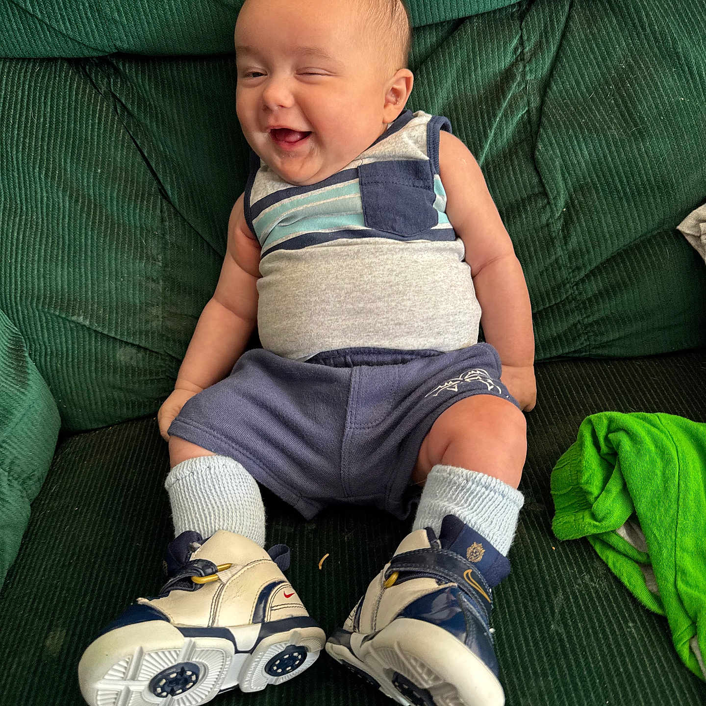 Grayson is registered to the contest to win money with this photo: baby, ball, clothing, couch, cushion, face, footwear, furniture, happy, head, homedecor, pants, person, photography, portrait, runningshoe, shoe, shorts, sitting, sneaker