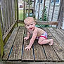Creed joined the competition — help win amazing prizes! baby, barefoot, child, clog, crawling, daytime, footwear, grass, house, outdoor, person, playful, railing, smiling, suburban, swim_diaper, toddler, window, wood, wooden_porch