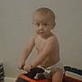 Creed joined the competition — help win amazing prizes! toddler, child, toy_truck, diaper, indoor, baby, play, vehicle, steering_wheel, floor, curious, blurry, young_child, person, plastic_toy, hands, face, head, sitting, room