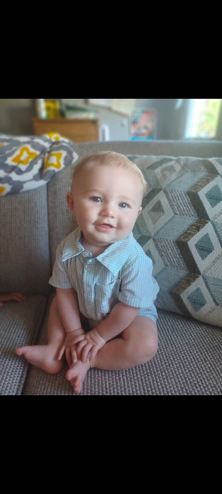 Kalvin joined the competition — help win amazing prizes! baby, baby_toddler_clothing, cheek, child, chin, comfort, dress, flooring, foot, happy, head, iris, pattern, person, product, sitting, skin, sleeve, smile, toddler