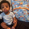 Alijah joined the competition — help win amazing prizes! baby, infant, child, bluey, backpack, striped_clothing, curly_hair, pout, sitting, indoor, cute, person, foot, hand, fabric, bedroom, toy_pattern, soft_lighting, portrait, young