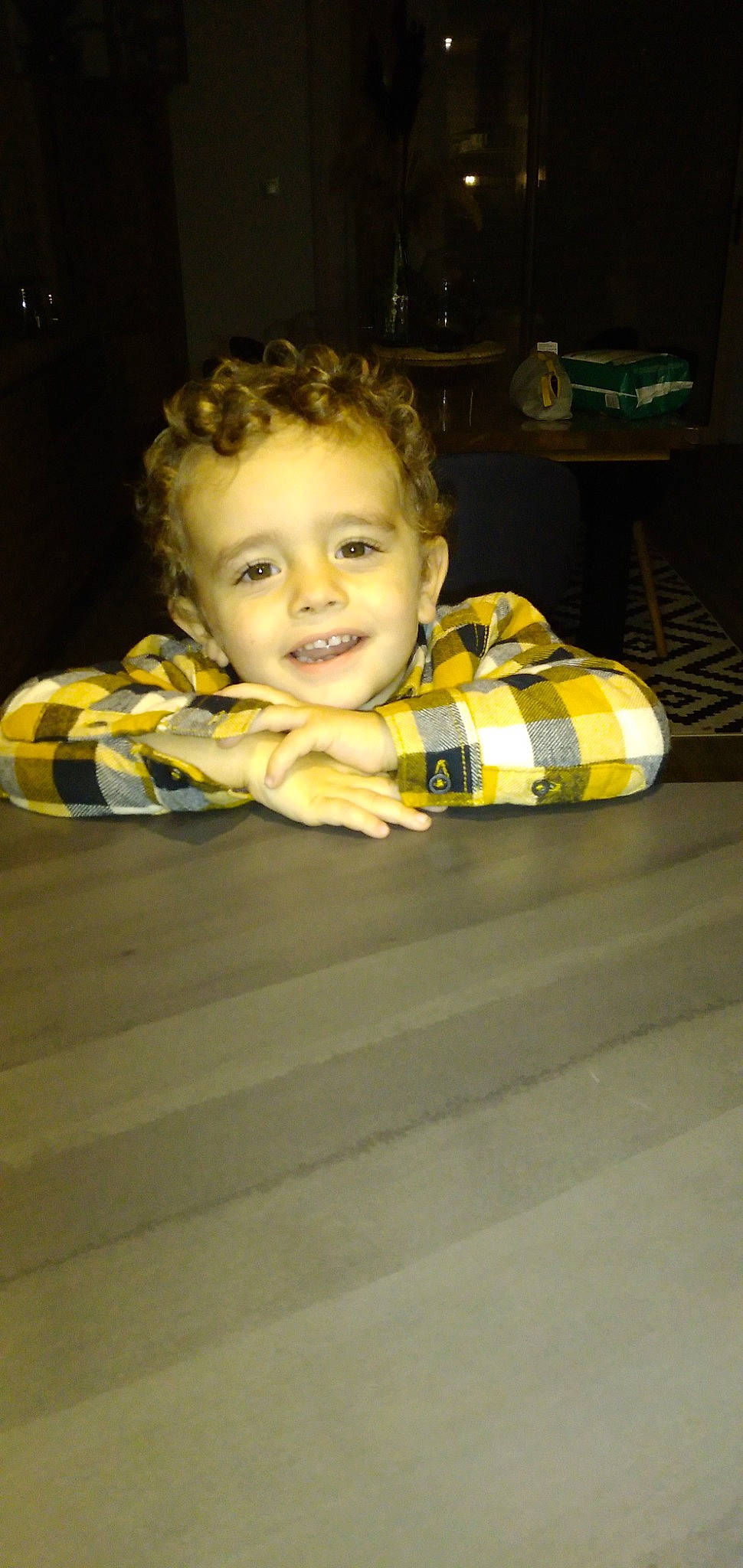 Nolan participe au concours pour gagner de l'argent avec cette photo : baby, cheek, child, comfort, darkness, flash_photography, floor, flooring, fun, hair, happy, hardwood, iris, joy, pattern, person, plaid, room, sitting, smile