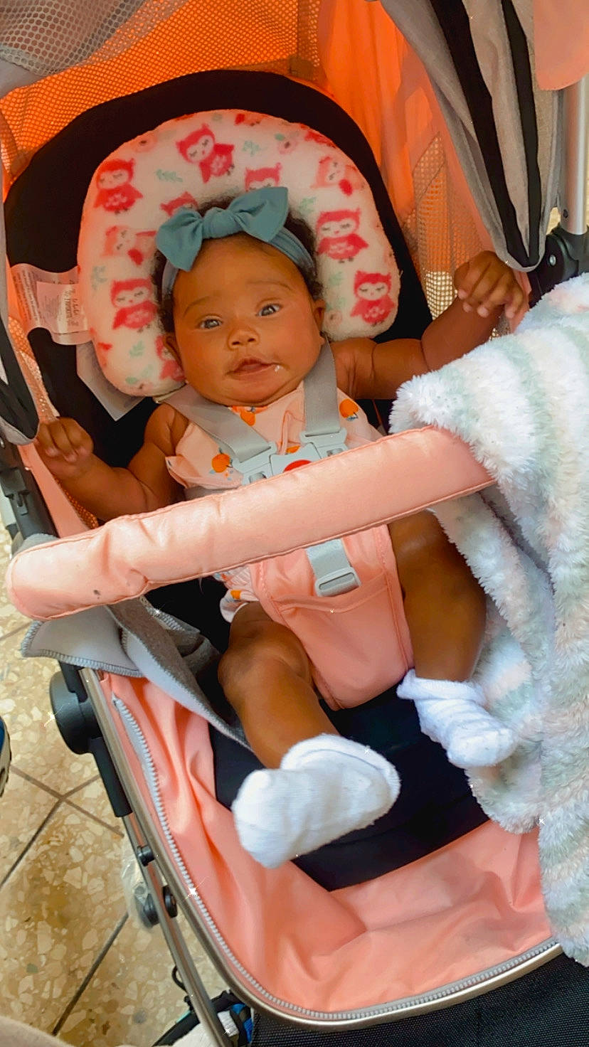 Royelle is registered to the contest to win money with this photo: baby, baby_carriage, baby_products, baby_toddler_clothing, chair, cheek, child, comfort, event, fun, lap, person, pink, product, sitting, skin, thigh, thumb, tire, toddler