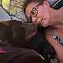 Grizzly is registered to the contest to win money with this photo: woman, dog, glasses, collar, couch, pillow, affection, indoor, closeup, face, pet, relaxation, casual, comfort, human, canine, interaction, love, bond, home
