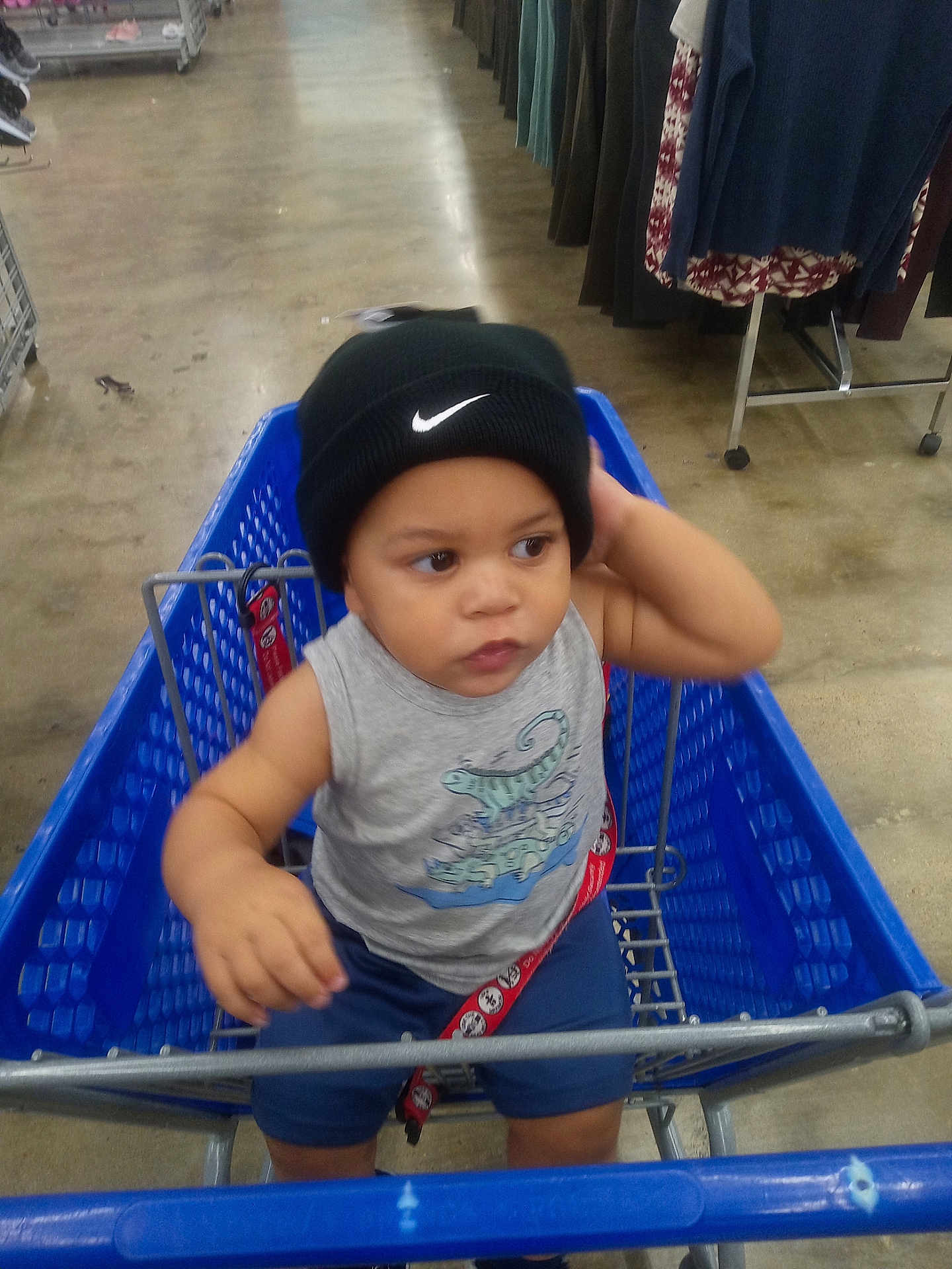 Malachi joined the competition — help win amazing prizes! toddler, child, shopping_cart, beanie, clothing, store, indoor, floor, rack, blue, casual_clothing, shorts, sleeveless_shirt, curious, young_child, person, retail, headwear, shopping, safety_belt