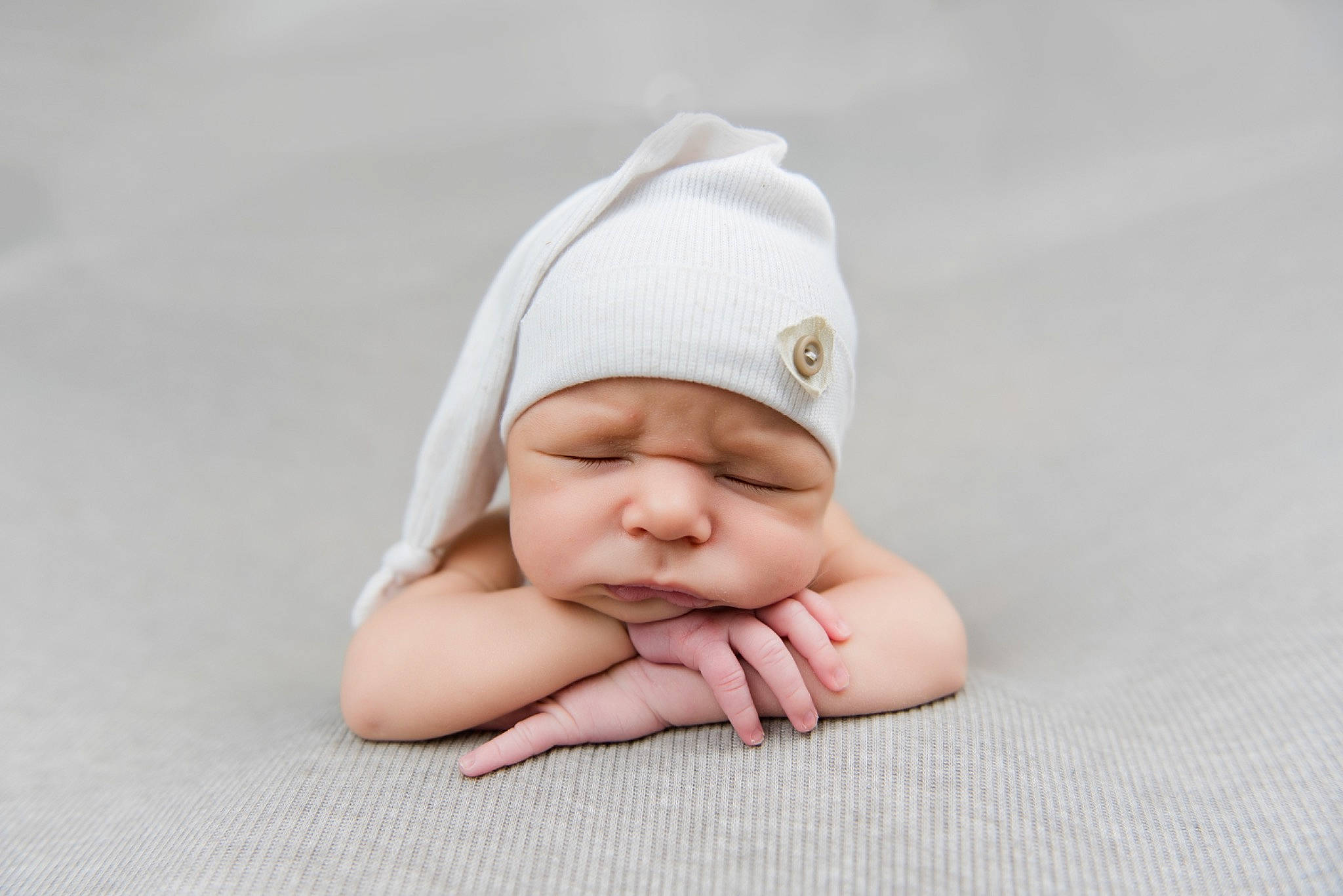 Tyce is registered to the contest to win money with this photo: baby, baby_products, baby_sleeping, baby_toddler_clothing, barefoot, beige, cheek, child, comfort, finger, flesh, foot, headwear, linens, mammal, person, skin, sleep, tummy_time