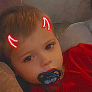 Sohan participe au concours pour gagner de l'argent avec cette photo : baby, child, closeup, couch, cute, digital_art, expression, face, glowing_horns, hair, indoors, light_effect, pacifier, person, portrait, red_clothing, relaxed, skin, toddler, young_child