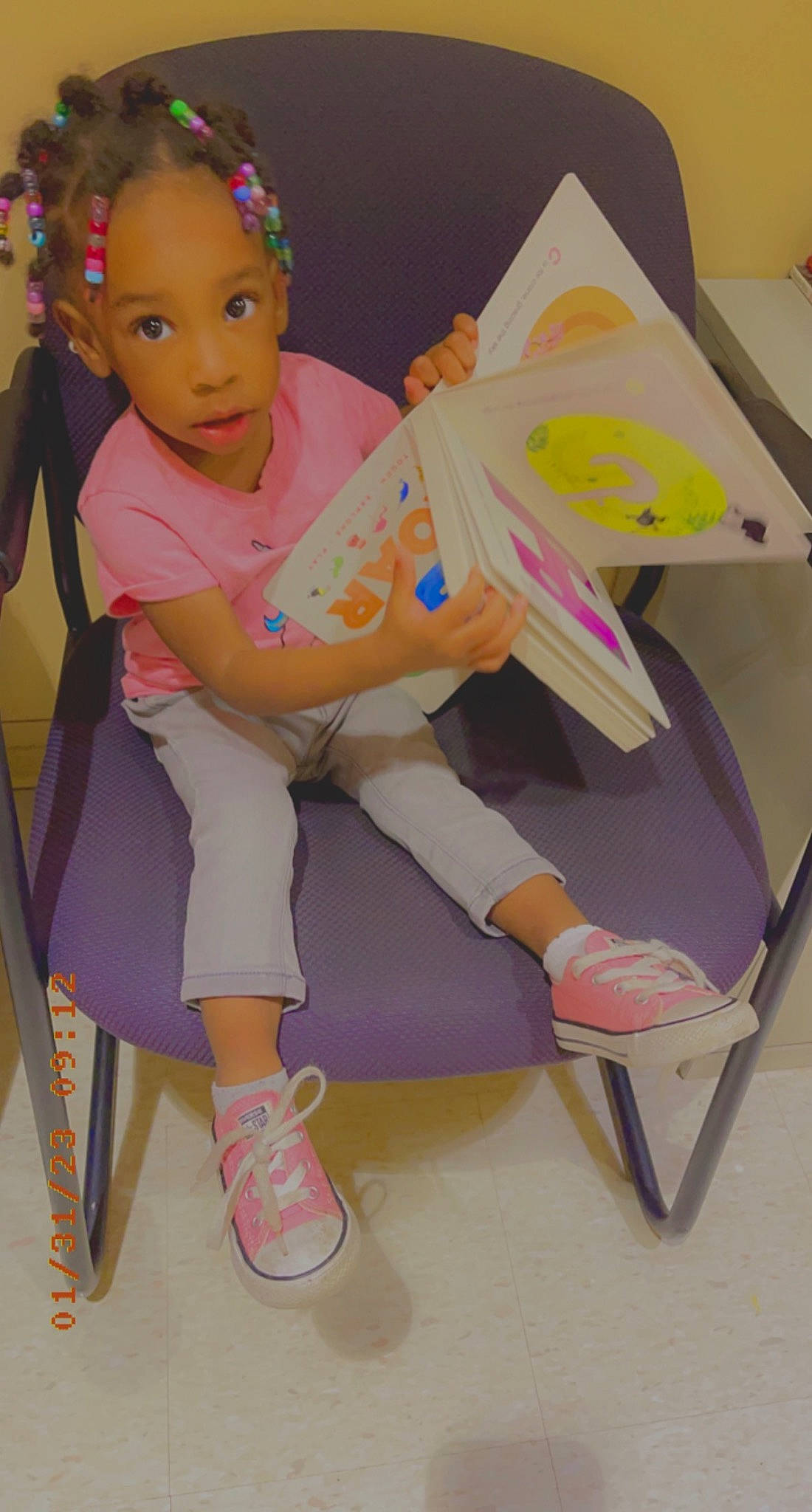 Kamaiyah is registered to the contest to win money with this photo: baby_products, baby_toddler_clothing, child, fun, human_leg, jewellery, knee, leisure, magenta, paper_product, pattern, person, pink, play, room, shoe, sitting, sneakers, sock, thigh