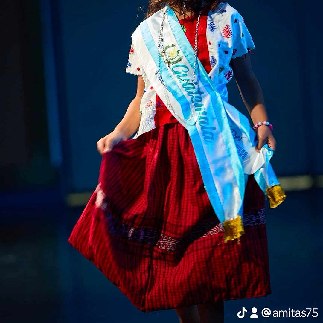 Laura joined the competition — help win amazing prizes! adult, clothing, dancepose, dancing, dress, face, fashion, female, hat, head, leisureactivities, performer, person, robe, soloperformance, stage, woman