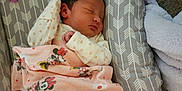Brylie is registered to the contest to win money with this photo: newborn, baby, sleeping, blanket, mickey_mouse, minnie_mouse, pacifier, baby_lounger, plush, cozy, infant, patterned, pink, gray, soft, foot, hand, clothing, cute, resting