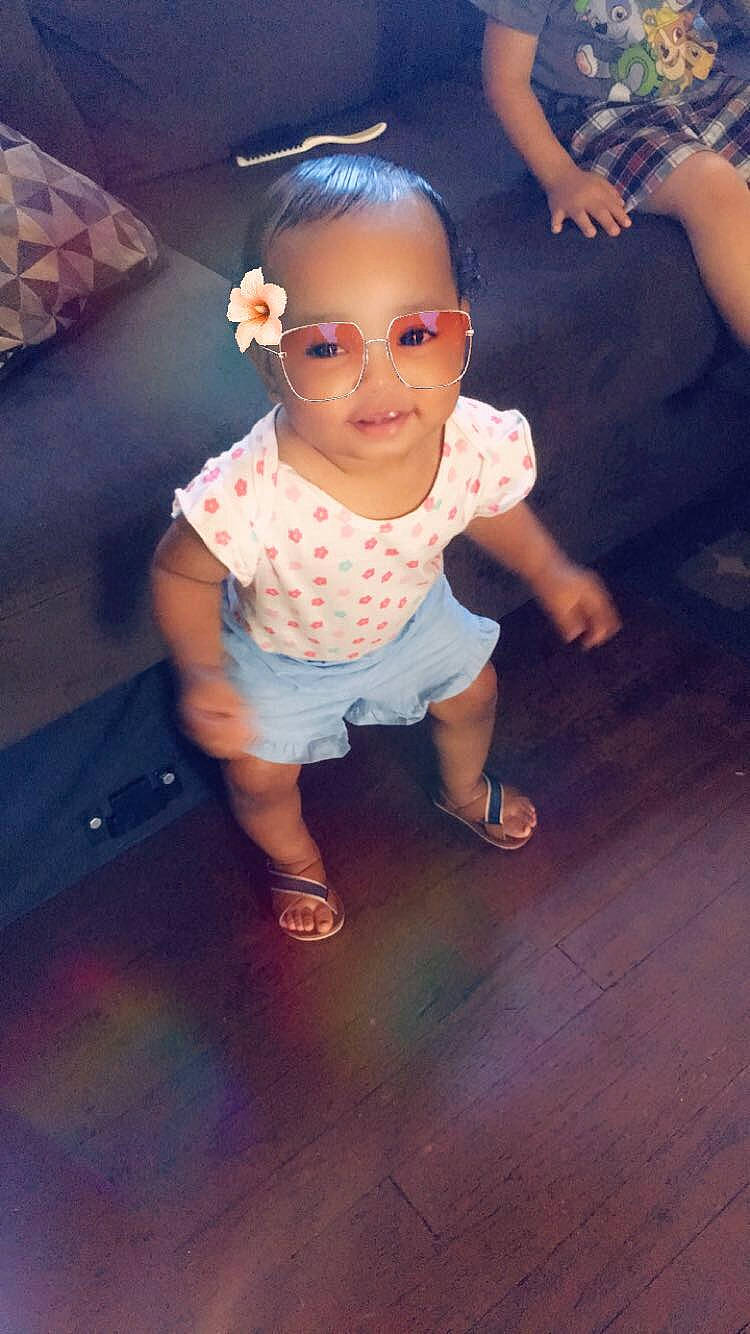 Jazelle is registered to the contest to win money with this photo: baby, child, cloud, cool, floor, footwear, fun, glasses, hand, head, people, person, pink, play, shoe, skin, sky, smile, t_shirt, toddler