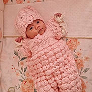 Ana-Khuslen participe au concours pour gagner de l'argent avec cette photo : baby, infant, crocheted_outfit, pink, hat, pacifier, plush_toy, floral_bedding, crib, socks, wide_eyes, lying_down, portrait, cute, newborn, hand, blanket, toy, bedding, nursery