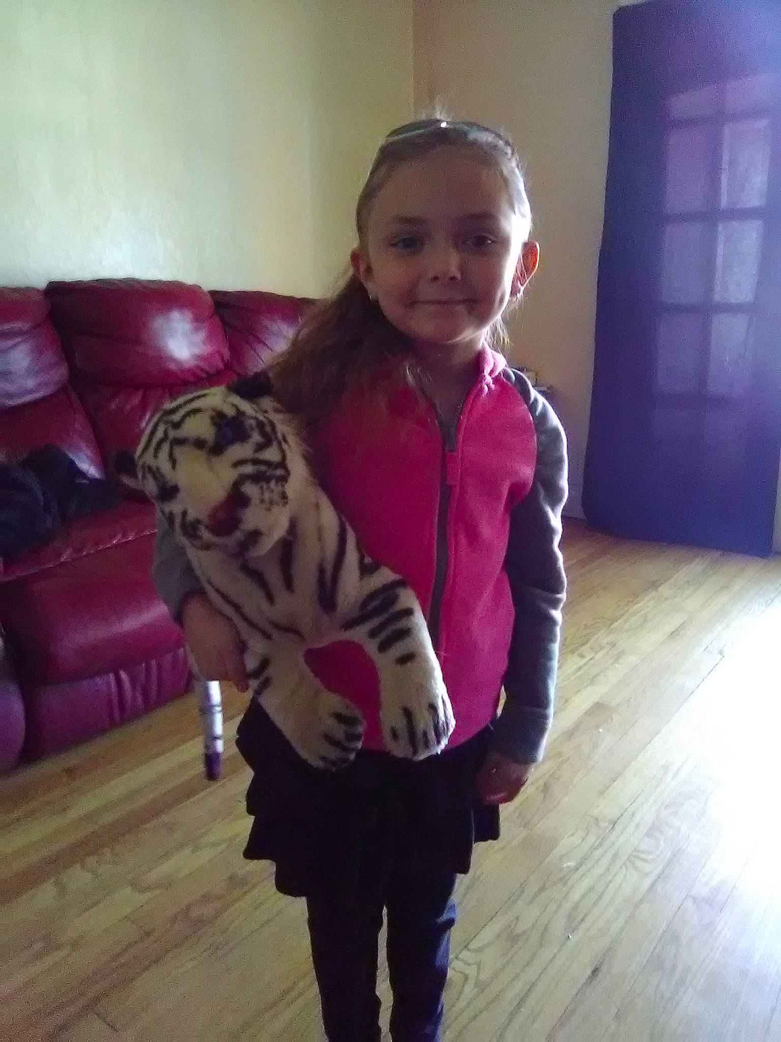 Skyla is registered to the contest to win money with this photo: carnivore, cat, child, fawn, felidae, fur, jacket, joy, outerwear, person, pink, sleeve, toddler