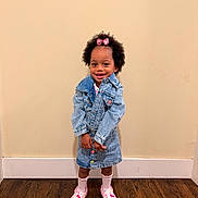 Trinity joined the competition — help win amazing prizes! child, toddler, girl, portrait, smiling, standing, denim, jacket, skirt, pink_bow, curly_hair, dark_skin, socks, shoes, fashion, indoors, wall, wooden_floor, full_body, happy