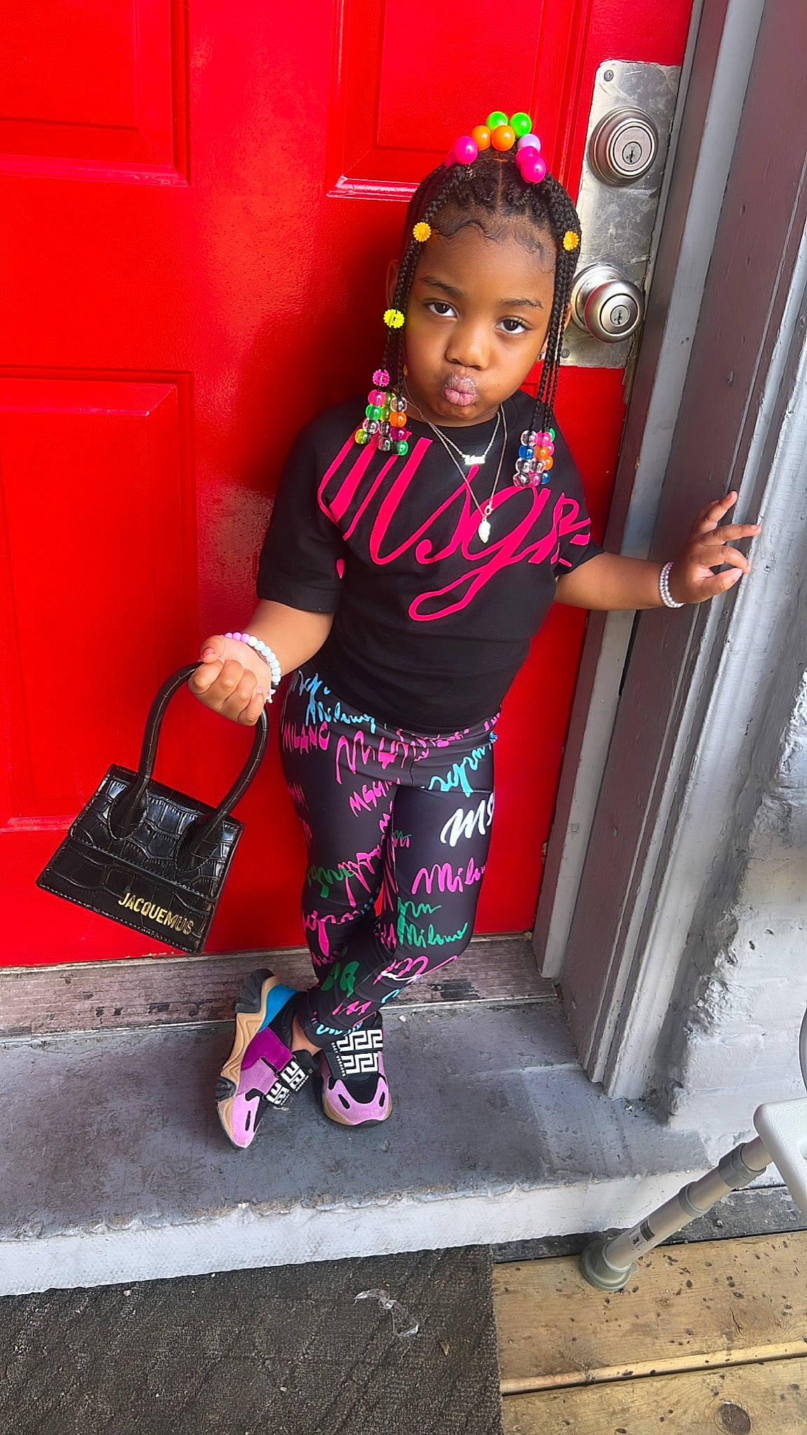 Kaliyah is registered to the contest to win money with this photo: bag, child, cool, door, electric_blue, fun, human_leg, luggage_and_bags, magenta, person, pink, purple, red, sandal, shoe, shorts, sneakers, standing, t_shirt, thigh
