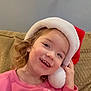 Jerzzie joined the competition — help win amazing prizes! child, smiling, santa_hat, pink_sweatshirt, unicorn, couch, curly_hair, indoors, cozy, holiday, cute, portrait, happy, young_child, casual_clothing, home, playful, festive, face, young_girl