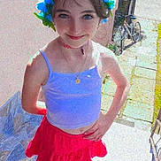 Natalia joined the competition — help win amazing prizes! child, girl, flower_crown, tank_top, red_skirt, outdoor, smiling, standing, bicycle, sidewalk, sunlight, necklace, choker, happy, person, footwear, socks, summer, fashion, portrait