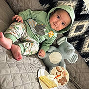 Mustafa joined the competition — help win amazing prizes! baby, infant, child, hoodie, pajamas, stuffed_animal, elephant_toy, cake, slice_of_cake, plate, sofa, blanket, quilt, smile, portrait, indoor, cozy, celebration, cute, happy