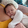 Inayah is registered to the contest to win money with this photo: baby, sleeping, child, person, blanket, cuddle, cozy, home, comfort, soft, pillow, clothing, indoor, rest, peaceful, pink, striped, adult, arm, relaxation
