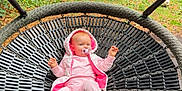 Eleanor is registered to the contest to win money with this photo: baby, child, dog, fun, grass, greenery, hoodie, infant, leisure, nature, outdoor, pacifier, park, pet, pink_clothing, playground, relaxing, shoes, swing, trees