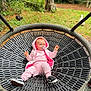 Eleanor is registered to the contest to win money with this photo: baby, child, swing, playground, outdoor, park, greenery, trees, grass, pink_clothing, pacifier, hoodie, shoes, dog, pet, nature, relaxing, fun, leisure, infant