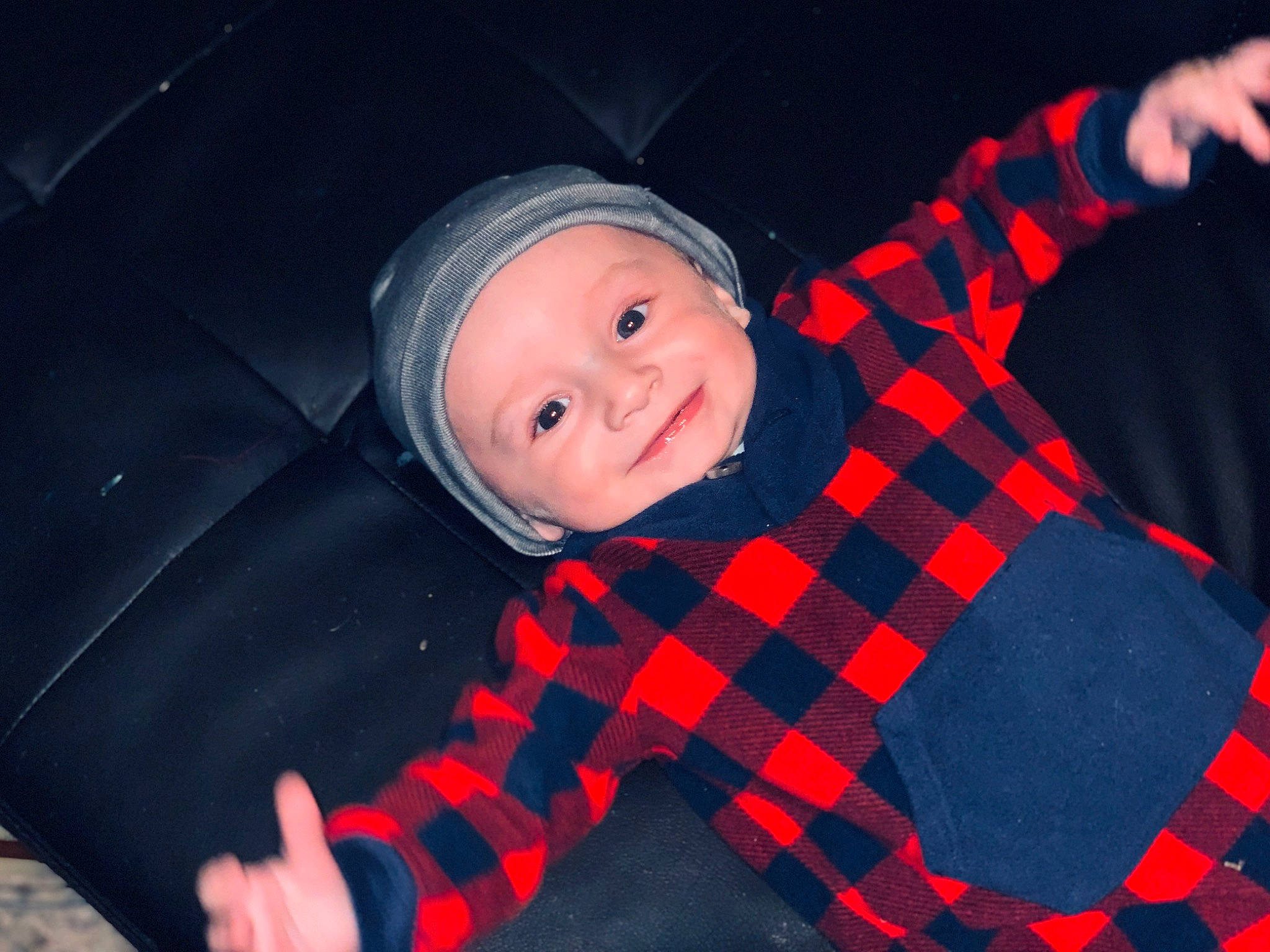 Kanon is registered to the contest to win money with this photo: automotive_lighting, baby, baby_toddler_clothing, cap, carmine, child, cool, electric_blue, facial_expression, flash_photography, fun, headwear, joy, mammal, mouth, pattern, person, plaid, sleeve, smile