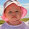 toddler, child, baby, hat, pink_hat, sunhat, outdoor, sky, clouds, grass, portrait, closeup, face, serious_expression, daylight, summer, clothing, nature, person, young_child