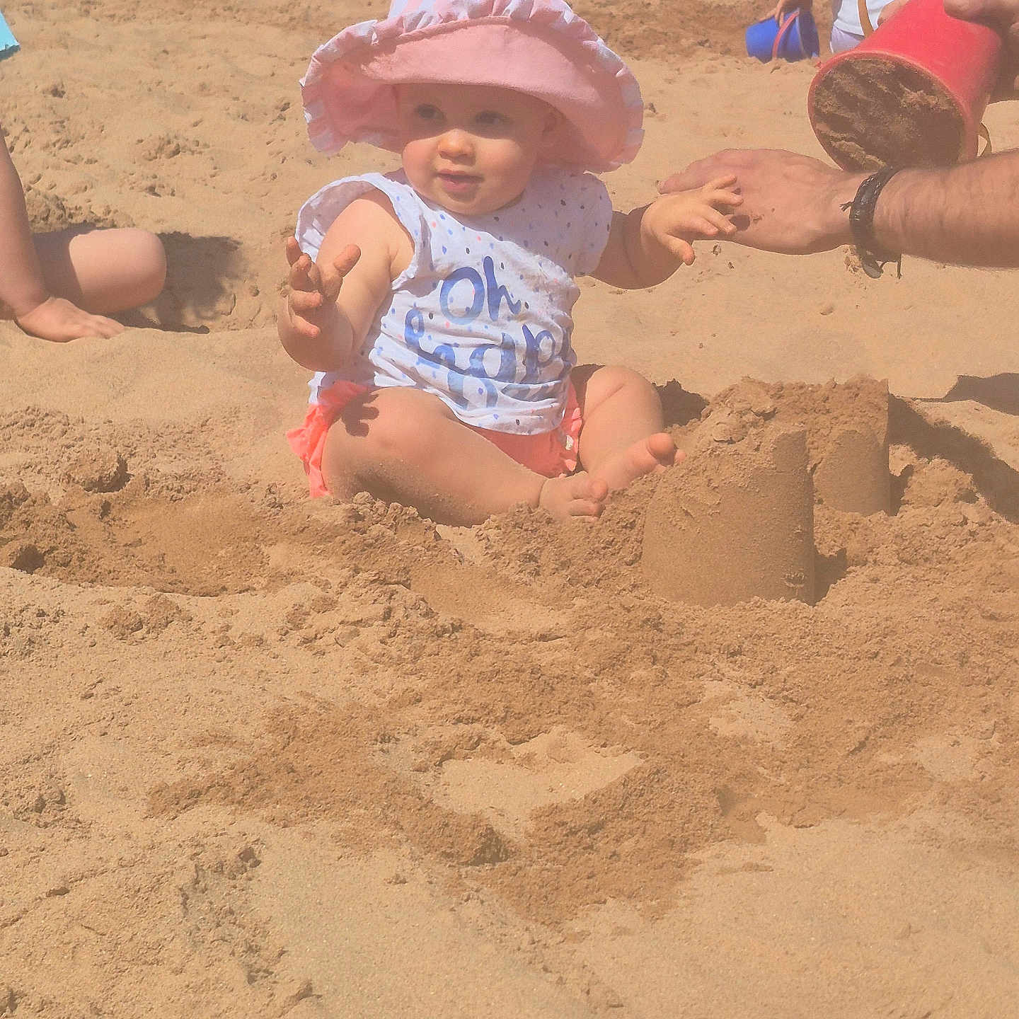 Freya joined the competition — help win amazing prizes! baby, beach, bucket, child, clothing, family, fun, hand, happy, outdoor, people, playing, relaxation, sand, sand_toys, sandcastle, summer, sunhat, sunshine, vacation