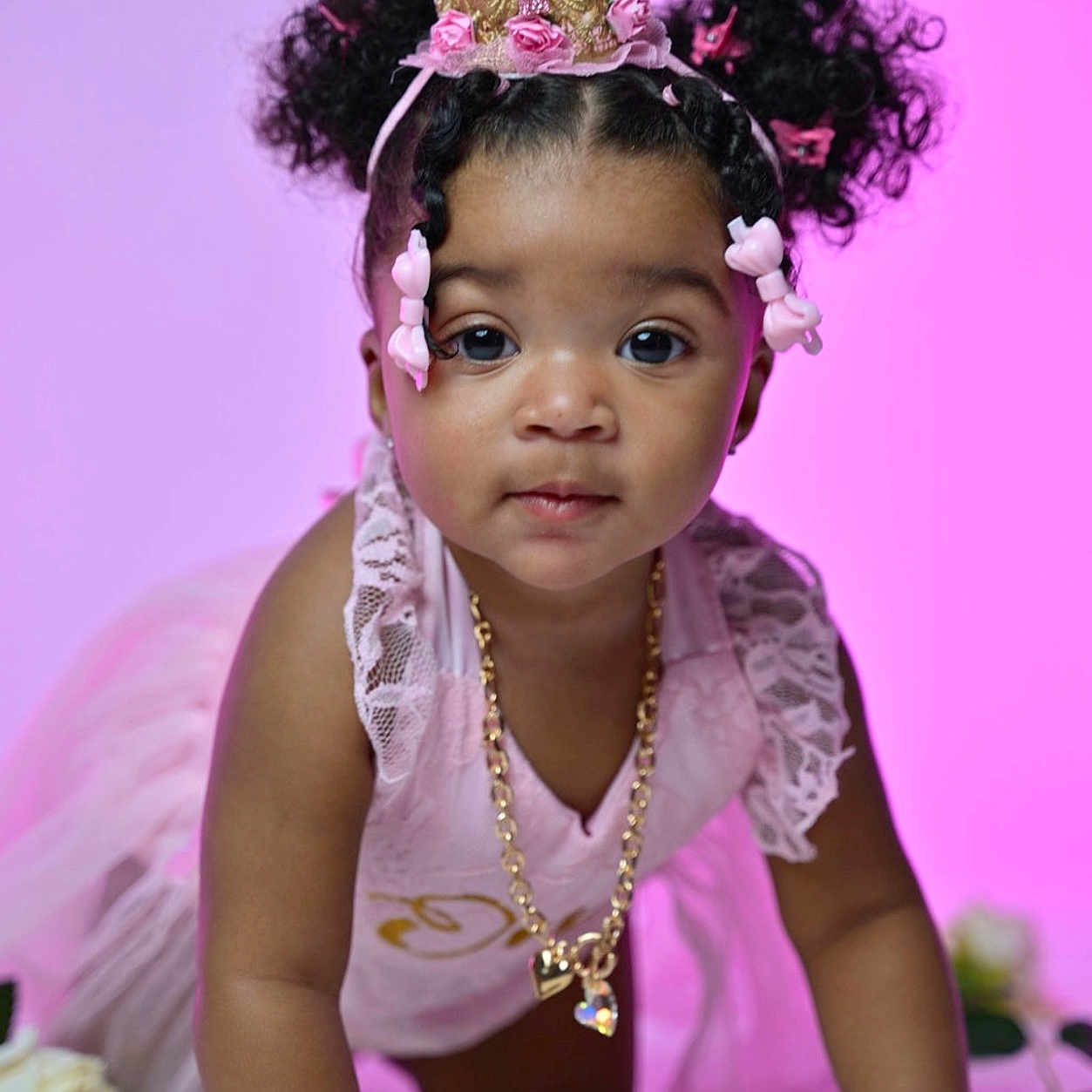 Naleeah Davis is registered to the contest to win money with this photo: accessories, bodypart, child, clothing, crawling, dress, face, female, finger, flower, girl, hand, head, jewelry, necklace, person, photography, portrait, purple, tiara
