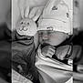 baby, sleeping, hat, blanket, plush_toy, bunny, soft_toy, cute, cozy, infant, child, resting, peaceful, black_and_white, portrait, indoors, newborn, wrapped, face, hands