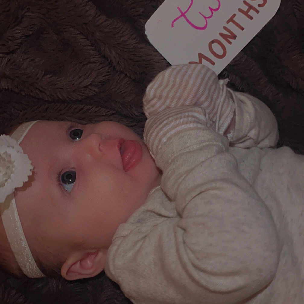 Avenleigh joined the competition — help win amazing prizes! baby, bodypart, bonnet, cap, clothing, couch, face, finger, furniture, hand, hat, head, knitwear, longsleeve, newborn, person, photography, portrait, sleeve, sweater