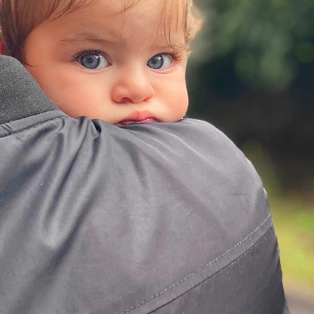 Sofi joined the competition — help win amazing prizes! toddler, child, face, blue_eyes, hair_bow, curious, portrait, outdoor, person, jacket, shoulder, close_up, baby, expression, cute, young, skin, head, nature, background_blur