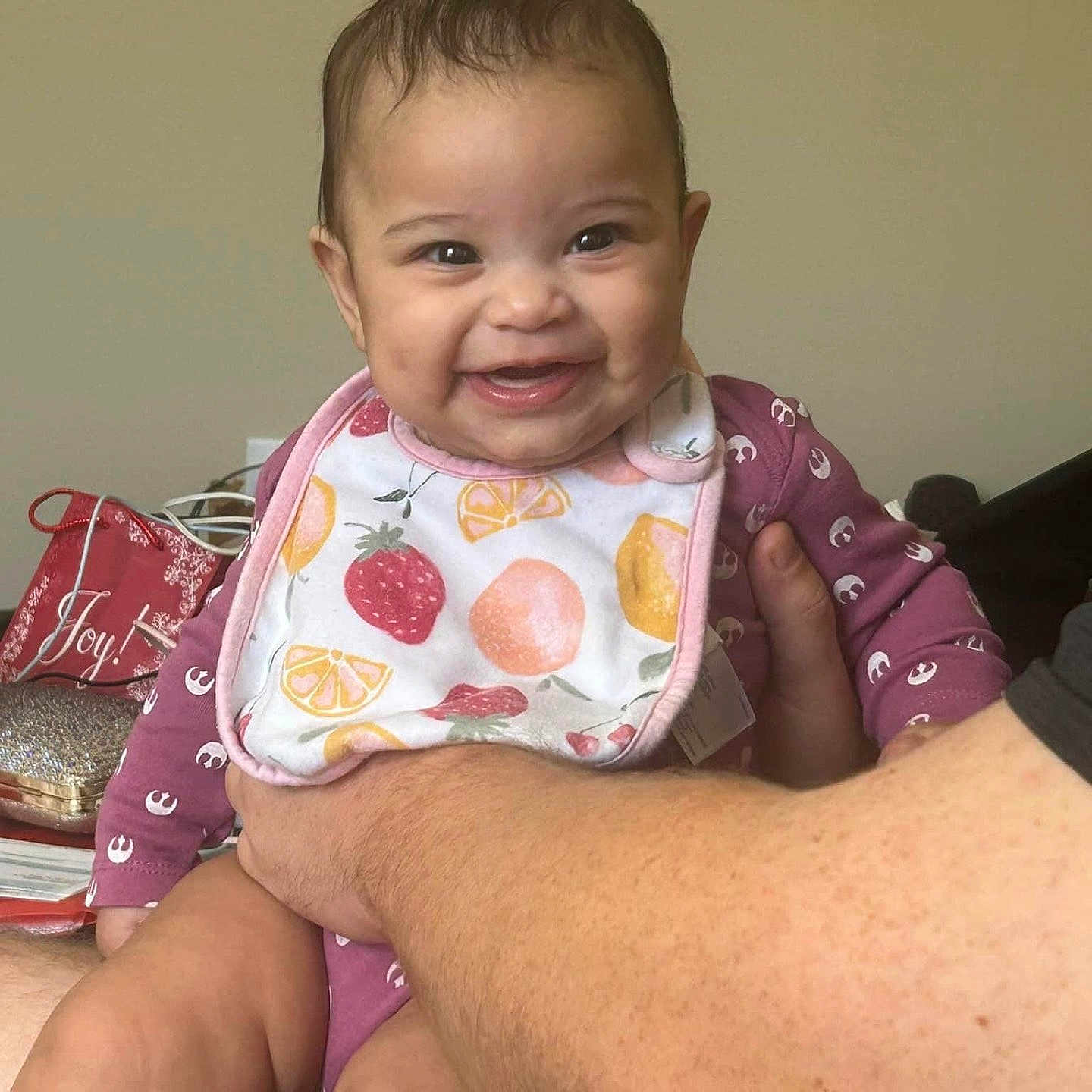 Amara is registered to the contest to win money with this photo: accessories, baby, babylaughing, bag, bib, bodypart, face, handbag, happy, head, jewelry, laughing, mouth, necklace, person, photography, portrait, sitting, smile, teeth