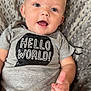 Deegan joined the competition — help win amazing prizes! baby, child, smiling, onesie, grey_clothing, text_print, hello_world, blanket, soft_texture, happy, portrait, infant, cute, face, blue_eyes, skin, hand, fingers, casual, indoor