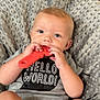 Deegan is registered to the contest to win money with this photo: baby, child, toy, wrench, onesie, gray_clothing, blue_eyes, sitting, cushion, texture, indoor, cute, infant, chewing, hand, legs, face, portrait, comfort, expression