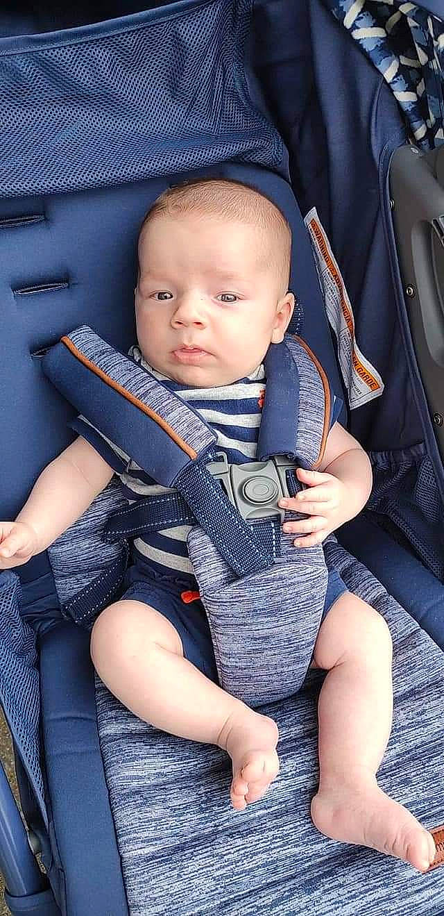 Shiloh is registered to the contest to win money with this photo: auto_part, automotive_design, baby, baby_carriage, baby_products, baby_toddler_clothing, car_seat, chair, child, comfort, electric_blue, finger, hand, lap, person, product, seat_belt, sitting, skin, thigh
