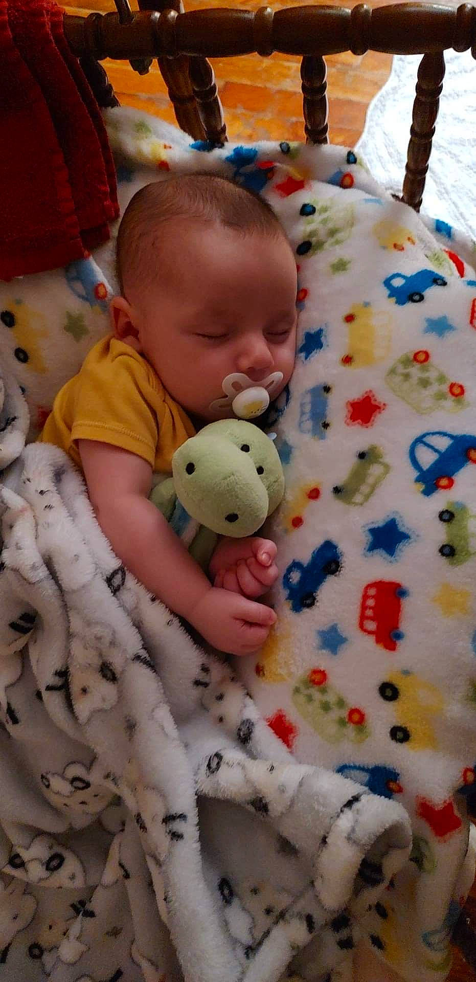 Shiloh is registered to the contest to win money with this photo: baby, baby_products, baby_toddler_clothing, cheek, child, comfort, face, fun, happy, head, human_body, infant_bed, linens, nose, pattern, person, skin, stuffed_toy, textile, toddler