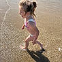 beach, bikini, child, fun, girl, happy, motion, nature, outdoor, playing, sand, sea, shadow, splashing, summer, sunlight, vacation, water, waves, wet_hair
