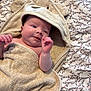Frankie joined the competition — help win amazing prizes! baby, towel, hood, bear_ears, blanket, floral_pattern, infant, skin, hand, face, cute, newborn, lying_down, soft_texture, bedroom, comfort, child, portrait, expression, wrapped