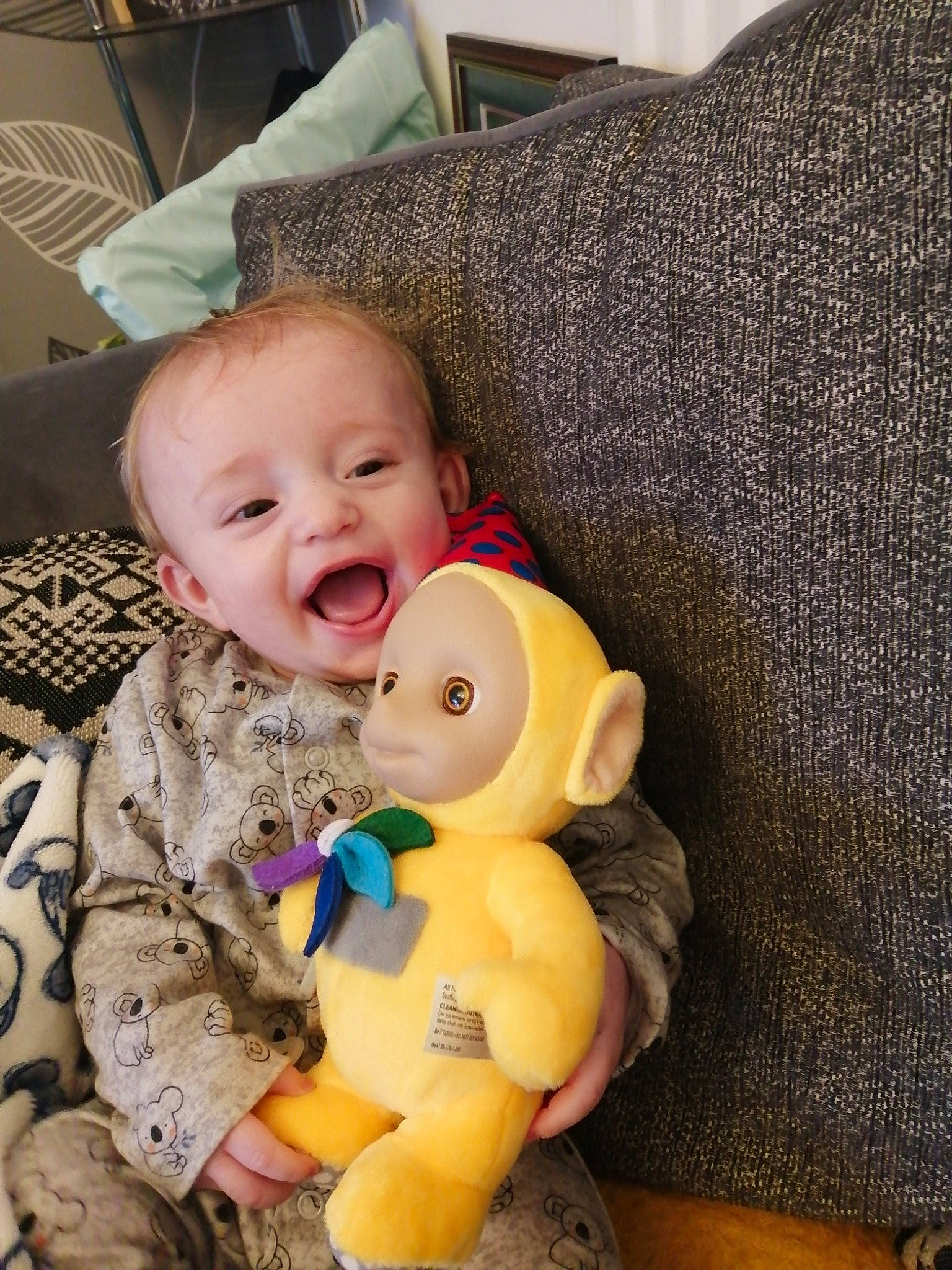 Isaac-lee is registered to the contest to win money with this photo: baby, baby_laughing, baby_toddler_clothing, cheek, child, comfort, couch, eye, happy, lap, linens, mammal, person, room, skin, smile, textile, toddler, toy, white