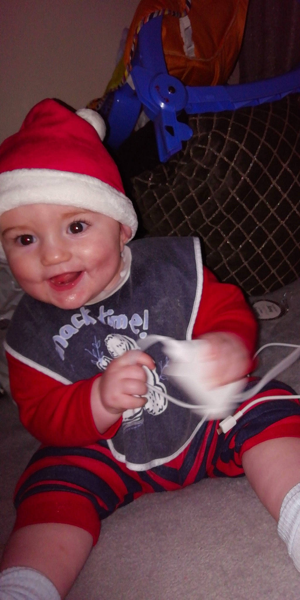 Jenson joined the competition — help win amazing prizes! baby, child, christmas, christmas_eve, fictional_character, headwear, holiday, lap, leg, person, santa_claus, sitting, smile, toddler