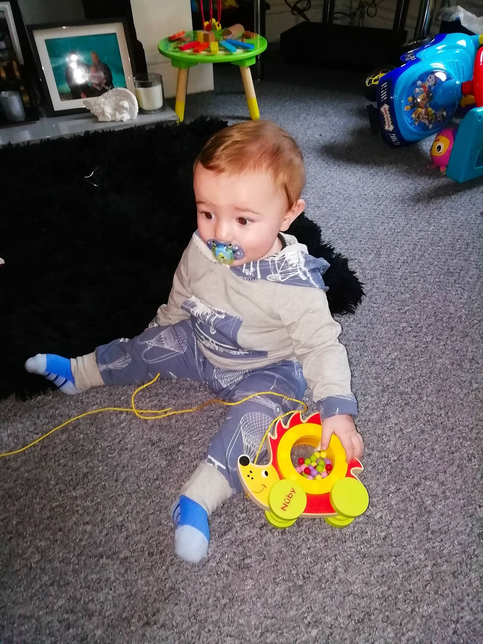 Jenson is registered to the contest to win money with this photo: baby, child, fun, joy, person, play, sitting, toddler, toy