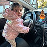 Ella participe au concours pour gagner de l'argent avec cette photo : air_freshener, car_interior, car_window, child, cute, dashboard, hand_on_wheel, leggings, looking_at_camera, passenger_seat, pink_jacket, portrait, puffer_coat, rearview_mirror, seat, seat_stitching, shoe, steering_wheel, timber_house, toddler