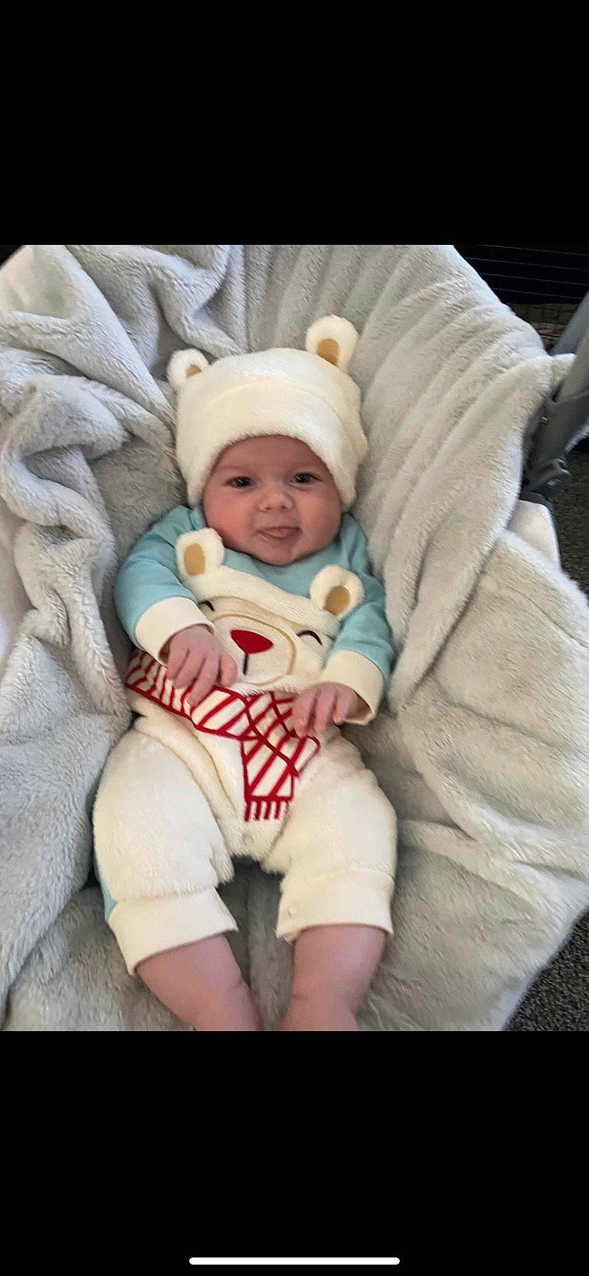 Huxley is registered to the contest to win money with this photo: baby, baby_products, baby_sleeping, baby_toddler_clothing, cheek, child, comfort, eye, fun, happy, hat, headwear, human_body, linens, person, sitting, skin, sleeve, smile, textile