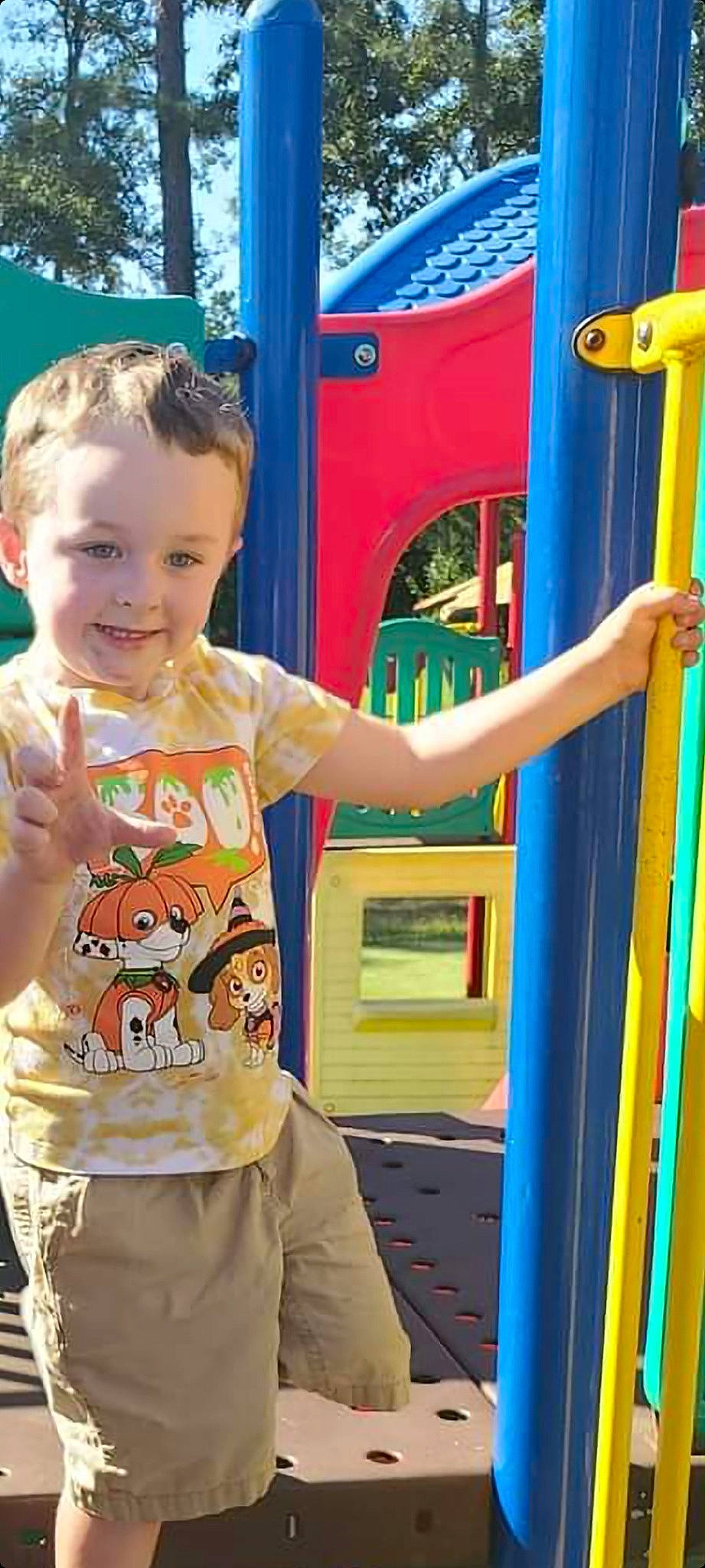 Karter is registered to the contest to win money with this photo: baby_toddler_clothing, blue, child, electric_blue, fun, gesture, green, happy, joy, leisure, person, photograph, playground, recreation, sleeve, smile, snapshot, standing, summer, t_shirt