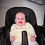 baby, child, high_chair, smiling, happy, indoor, cozy_clothing, face, person, infant, seated, cute, light_skin, buttoned_sweater, furniture, home, portrait, young_child, expression, comfort