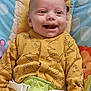 Kobie is registered to the contest to win money with this photo: baby, smiling, yellow_onesie, dinosaur_pattern, baby_seat, giraffe_design, toy, happy, infant, child, playful, colorful, seatbelt, cute, portrait, indoors, face, person, childrens_toy, closeup