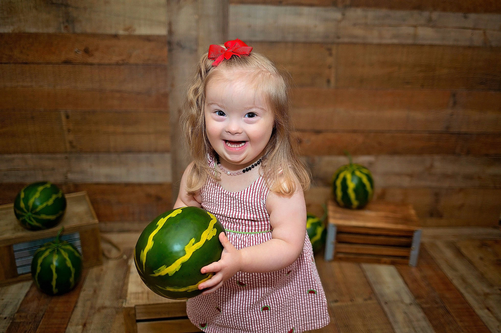 Abigail is registered to the contest to win money with this photo: ball, child, facial_expression, flash_photography, fun, grass, happy, hardwood, joy, leisure, natural_foods, people_in_nature, person, plant, play, shorts, smile, sports_equipment, sports_toy, team_sport