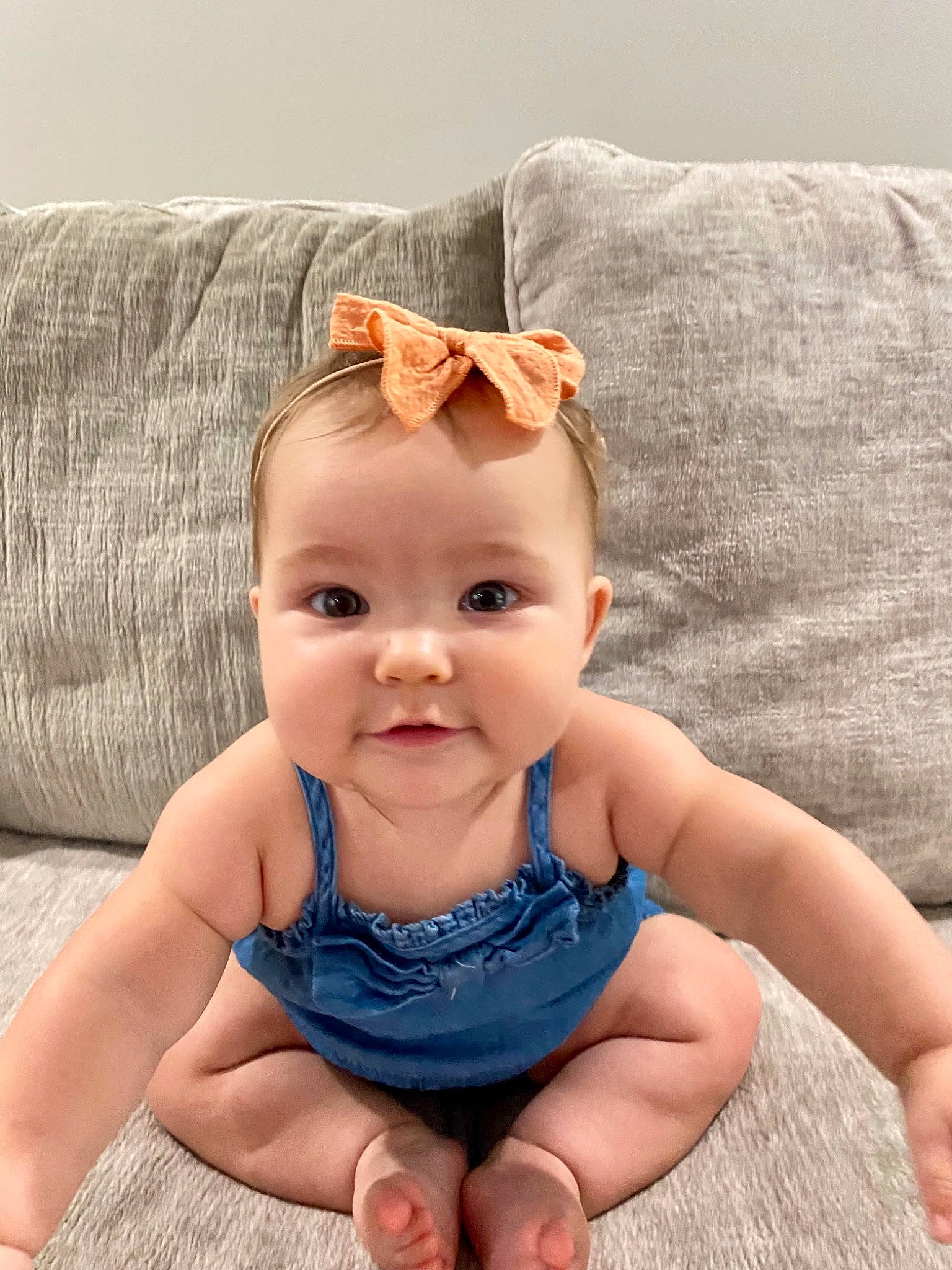 Matilda is registered to the contest to win money with this photo: baby, baby_toddler_clothing, cheek, eye, eyelash, face, finger, foot, hand, happy, head, iris, lip, mouth, pattern, person, skin, textile, thumb, toddler